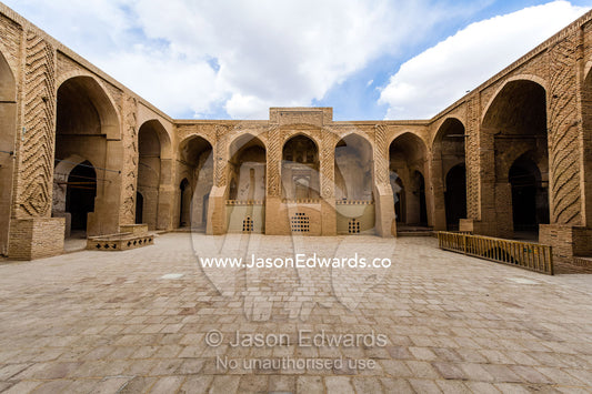 The paved main courtyard the Jame Mosque as seen through the riwaq. Jameh Mosque of Nain, Nain, Nain County, Isfahan Province, Iran.