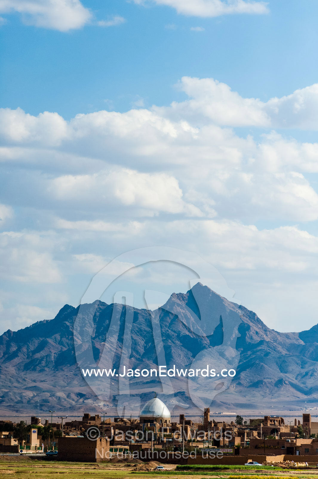 The dome of a village Mosque visible across a rural plain. Road to Yazd, Yazd Province, Islamic Republic of Iran.