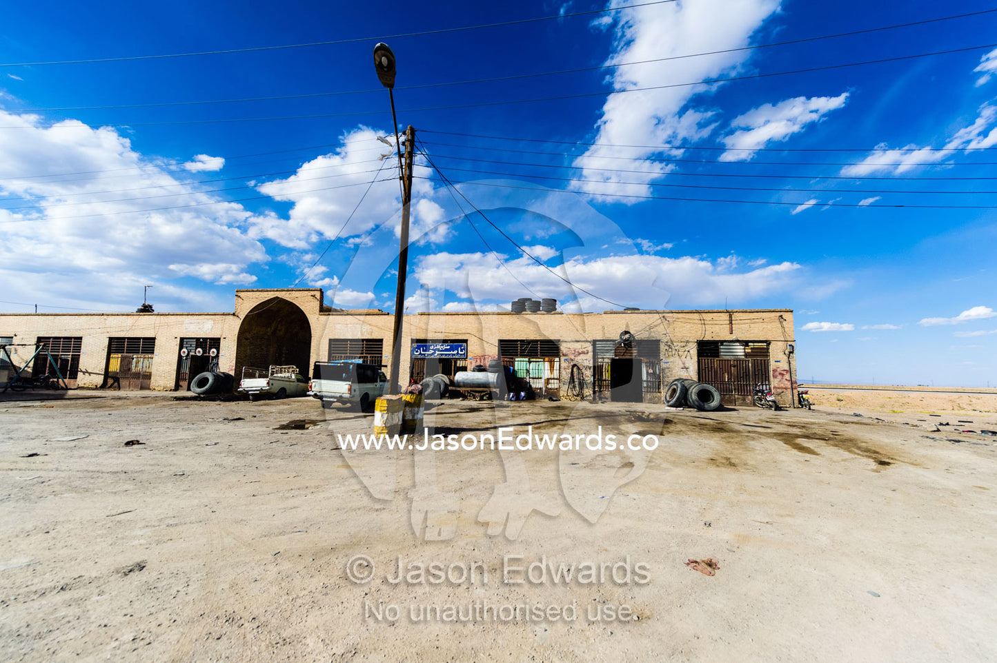 A truck stop and mechanics workshop beside a highway. Road to Yazd, Yazd Province, Islamic Republic of Iran.