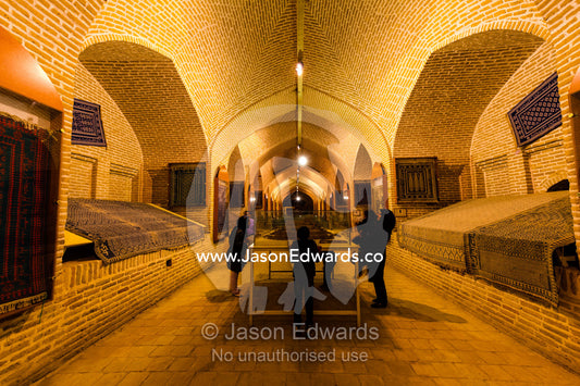 An Iranian family examines displays in a museum in an ancient caravanserai. Meybod Caravanserai and Carpet Museum, Meybod, Meybod County, Yazd Province, Islamic Republic of Iran.