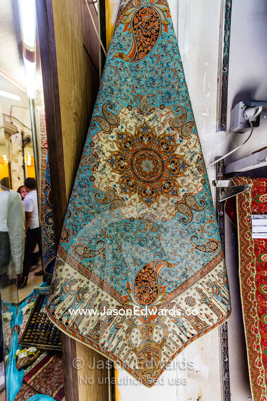 A shop in a bazaar selling termeh fabric an intricate and delicate cloth. Yazd, Yazd Province, Islamic Republic of Iran.