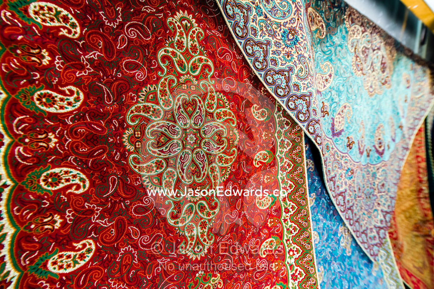 A shop in a bazaar selling termeh fabric an intricate and delicate cloth. Yazd, Yazd Province, Islamic Republic of Iran.