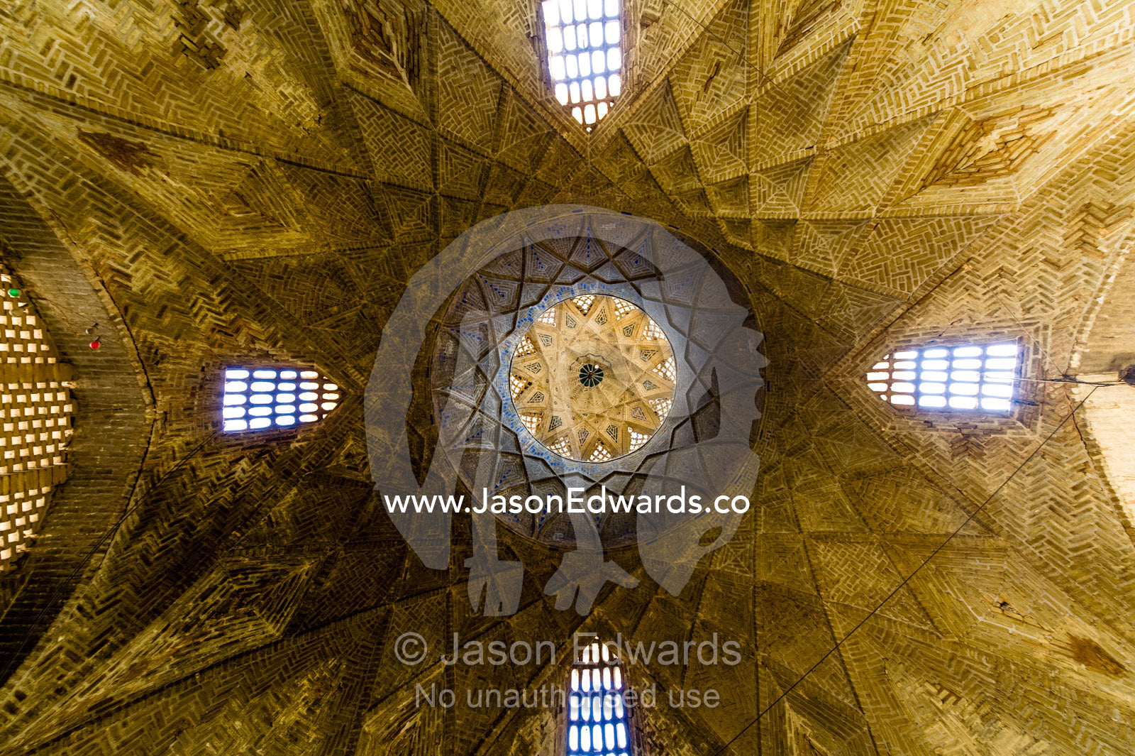 The wonderful geometric ceiling and skylight windows of an ancient bazaar. Yazd, Yazd Province, Islamic Republic of Iran.