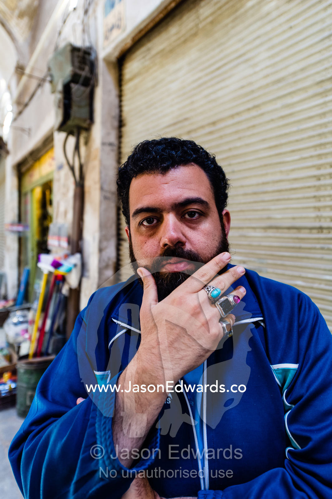 A merchant displays his silver and precious stone rings he sells in a bazaar. Yazd, Yazd Province, Islamic Republic of Iran.