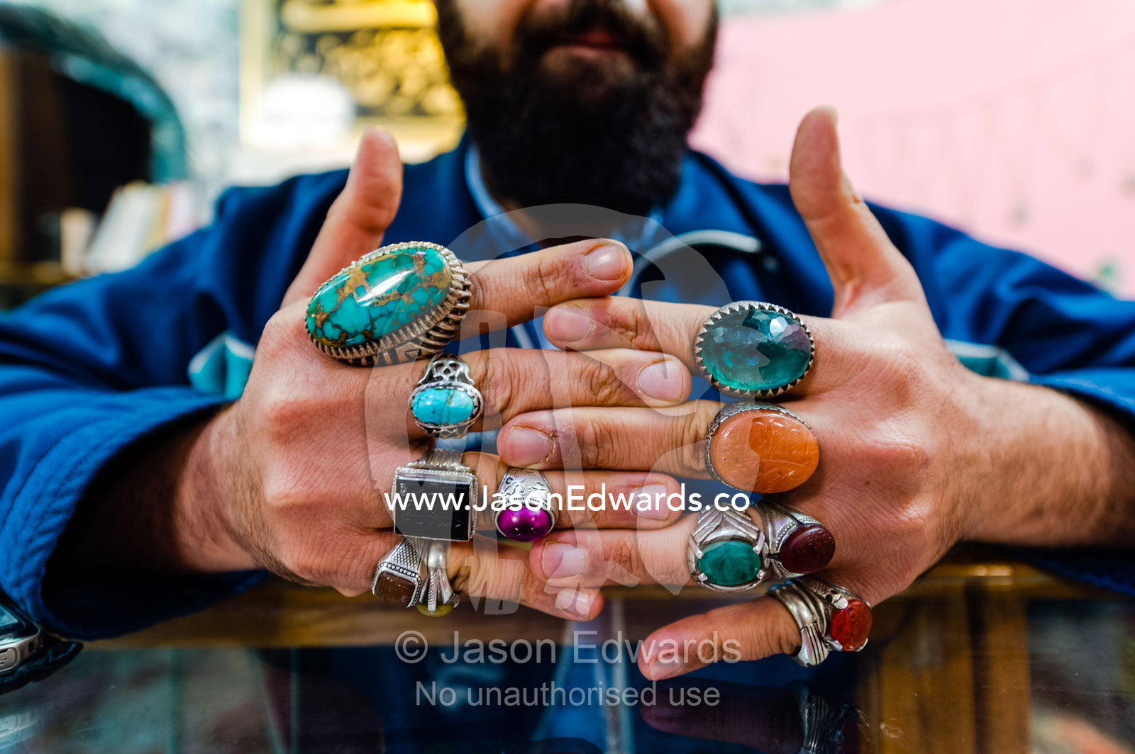 A merchant displays his silver and precious stone rings he sells in a bazaar. Yazd, Yazd Province, Islamic Republic of Iran.
