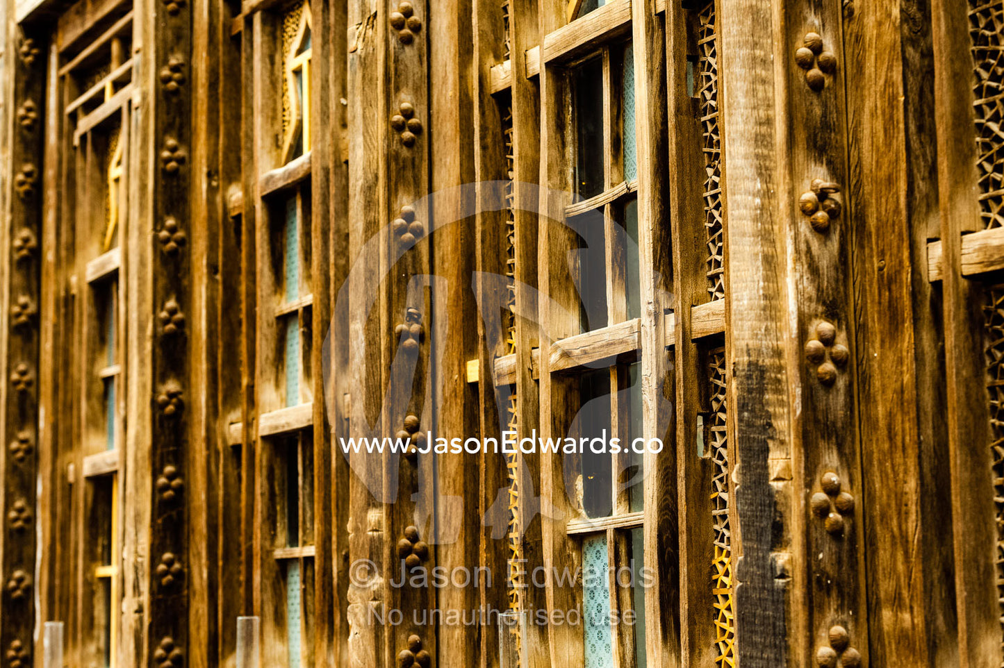 Weathered window frames ina traditional house converted into a boutique hotel. Malek-o Tojjar Hotel, Yazd, Yazd Province, Islamic Republic of Iran.