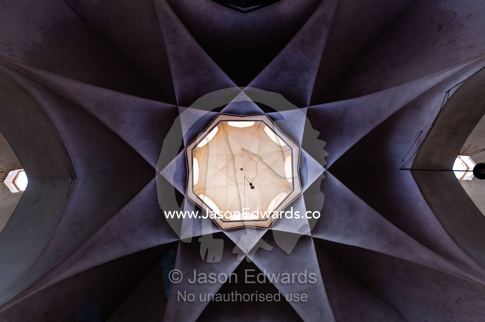 The wonderful geometric star-shaped ceiling of an ancient bazaar. Yazd, Yazd Province, Islamic Republic of Iran.