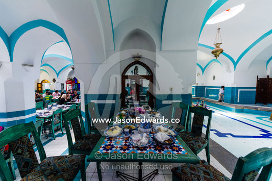 The light-filled interior ceiling dome of an antique public bathhouse converted into a tea house. Hammam-e khan, Yazd, Yazd Province, Islamic Republic of Iran.