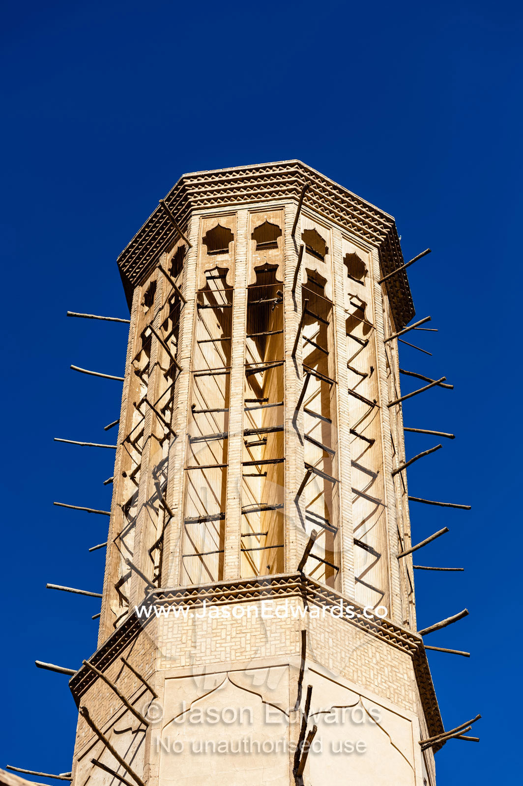 An enormous windcatcher towers into the blue sky. Dowlat Abad Garden, Yazd, Yazd Province, Islamic Republic of Iran.