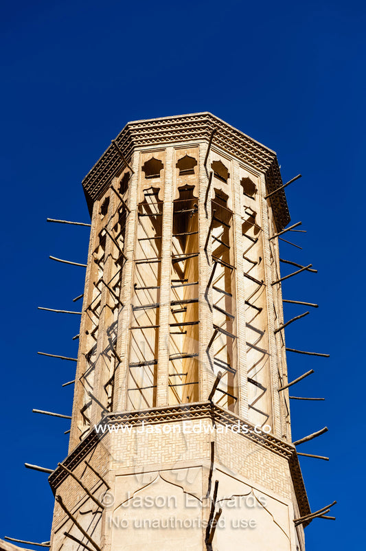 An enormous windcatcher towers into the blue sky. Dowlat Abad Garden, Yazd, Yazd Province, Islamic Republic of Iran.