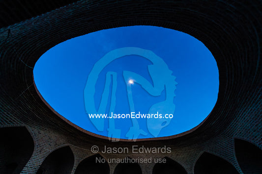 The moon visible through the oval ceiling of a caravanserai. Kharanagh, Yazd, Yazd Province, Islamic Republic of Iran.