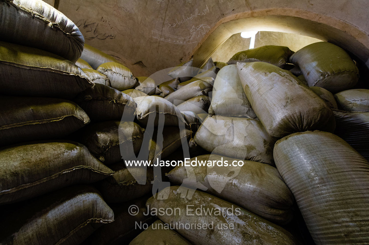Sunrays touch bags of henna powder stored in an ancient henna mill. Yazd, Yazd Province, Islamic Republic of Iran.