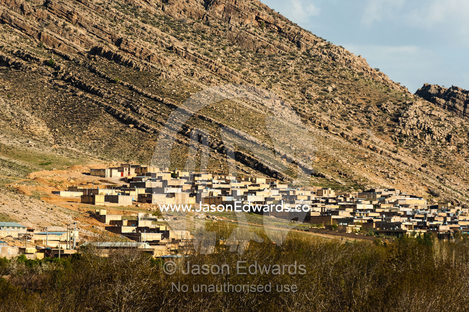 A desert village on the slopes of a barren mountain. Fars Province, Islamic Republic of Iran.