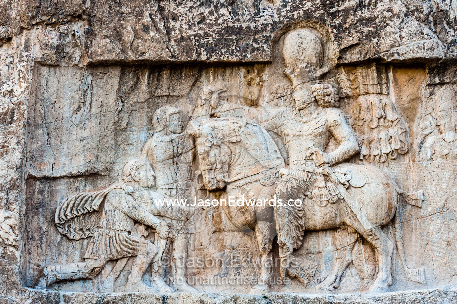 A carving of the Victory of King Shapour the 1st against Roman emperor Valerian at the archeological site of Naqsh-e Rustam also known as the Necropolis. Tombs of the Kings, Naqsh-e Rustam, Fars Province, Islamic Republic of Iran.