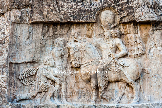 A carving of the Victory of King Shapour the 1st against Roman emperor Valerian at the archeological site of Naqsh-e Rustam also known as the Necropolis. Tombs of the Kings, Naqsh-e Rustam, Fars Province, Islamic Republic of Iran.