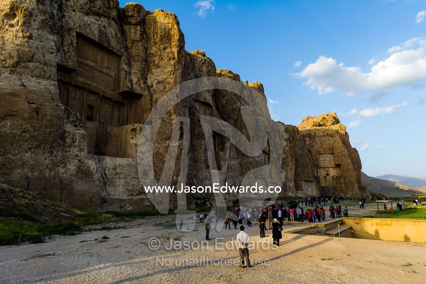 Iranian tourists visit the four tombs belonging to Achaemenid kings carved from the rock face at the archeological site of Naqsh-e Rustam also known as the Necropolis. Tombs of the Kings, Naqsh-e Rustam, Fars Province, Islamic Republic of Iran.