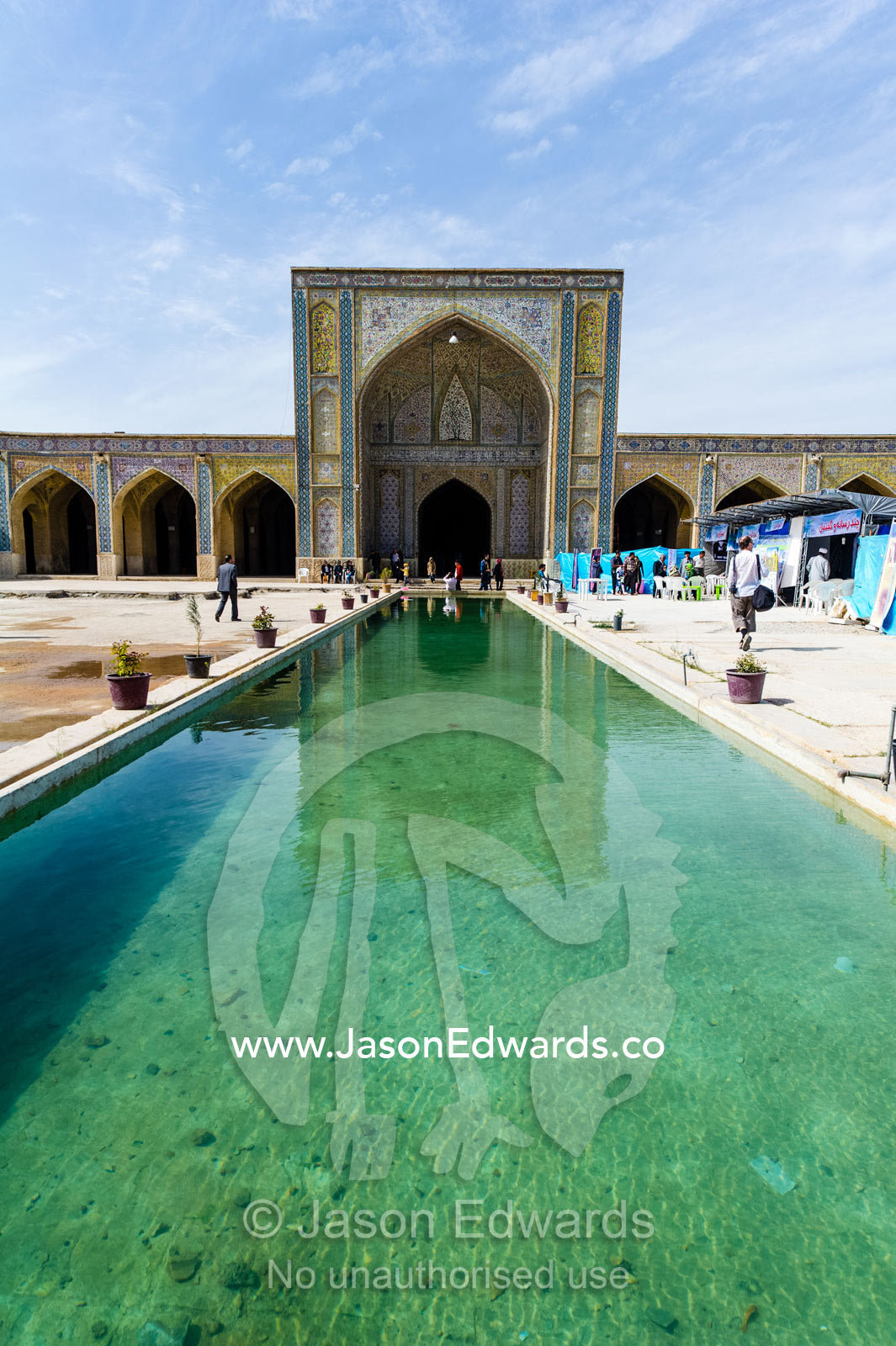 The iwan and sahn, ornamental pond, of the Vikal Mosque. Vakil Mosque, Shiraz, Fars Province, Islamic Republic of Iran.