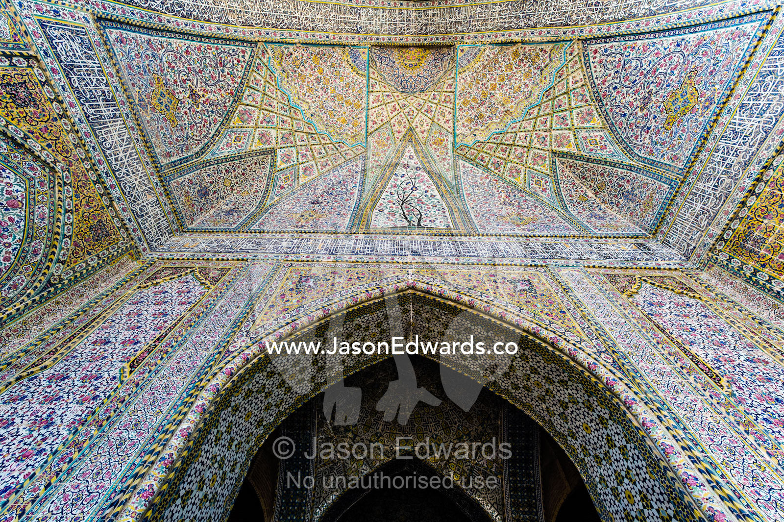 The intricate tiled muqarnas on the vaulted surface of the iwan in Vikal Mosque. Vakil Mosque, Shiraz, Fars Province, Islamic Republic of Iran.