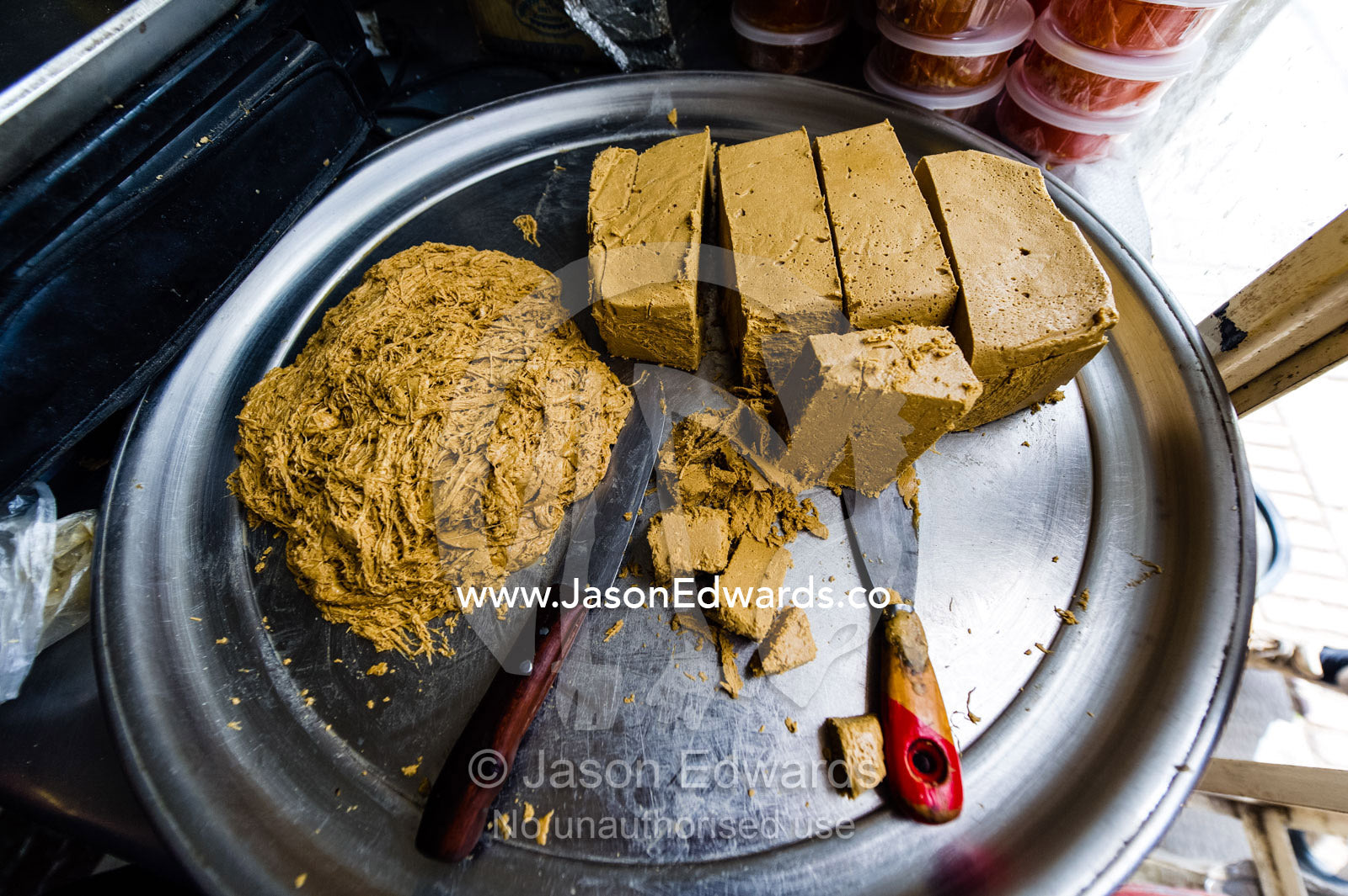 Slabs of sesame pudding for sale in a bazaar market. Shiraz, Fars Province, Islamic Republic of Iran.