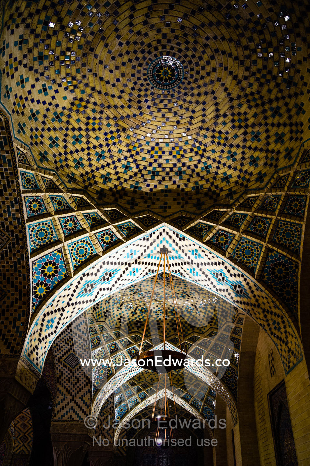 Spiraling tile patterns on the ceiling of the Nasir ol Molk Mosque. Nasir ol Molk Mosque, Shiraz, Fars Province, Islamic Republic of Iran.