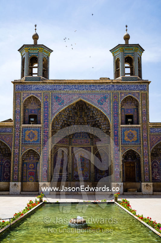 The iwan and sahn, ornamental pond, of the Nasir ol Molk Mosque. Nasir ol Molk Mosque, Shiraz, Fars Province, Islamic Republic of Iran.