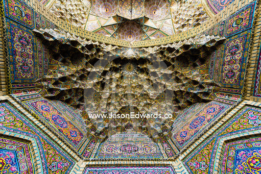 The intricate tiled muqarnas on the vaulted surface of the iwan of Nasir ol Molk Mosque. Nasir ol Molk Mosque, Shiraz, Fars Province, Islamic Republic of Iran.