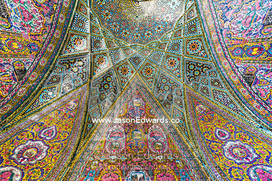 The intricate tiled muqarnas on the vaulted surface of the iwan of Nasir ol Molk Mosque. Nasir ol Molk Mosque, Shiraz, Fars Province, Islamic Republic of Iran.