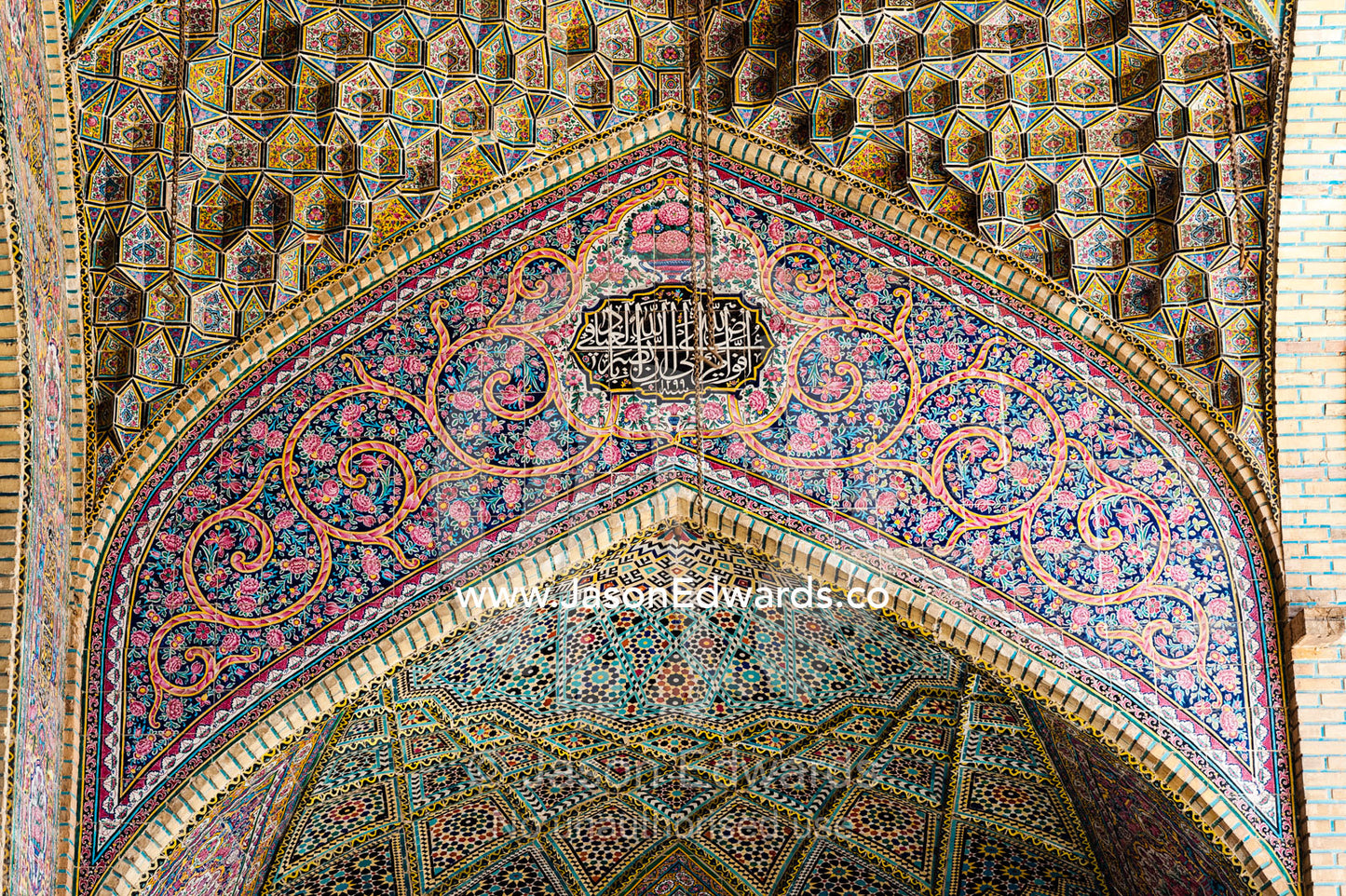The intricate tiled muqarnas on the vaulted surface of the iwan of Nasir ol Molk Mosque. Nasir ol Molk Mosque, Shiraz, Fars Province, Islamic Republic of Iran.