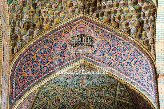 The intricate tiled muqarnas on the vaulted surface of the iwan of Nasir ol Molk Mosque. Nasir ol Molk Mosque, Shiraz, Fars Province, Islamic Republic of Iran.