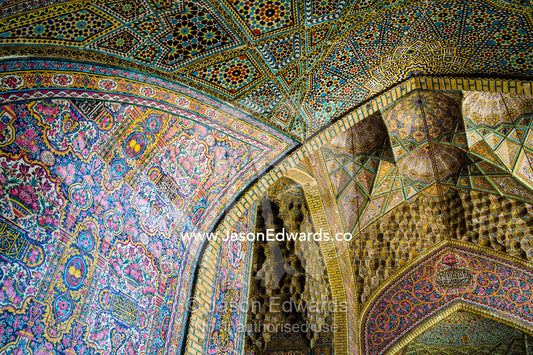 The intricate tiled muqarnas on the vaulted surface of the iwan of Nasir ol Molk Mosque. Nasir ol Molk Mosque, Shiraz, Fars Province, Islamic Republic of Iran.