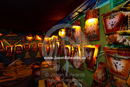 A stall at the ruins of Persepolis selling souvenier clocks. Persepolis, Shiraz, Fars Province, Islamic Republic of Iran.