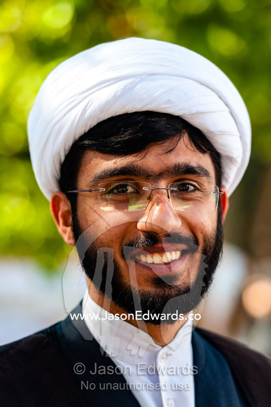 The smiling, peaceful face of a young clergyman at a mosque. Shiraz, Fars Province, Islamic Republic of Iran.