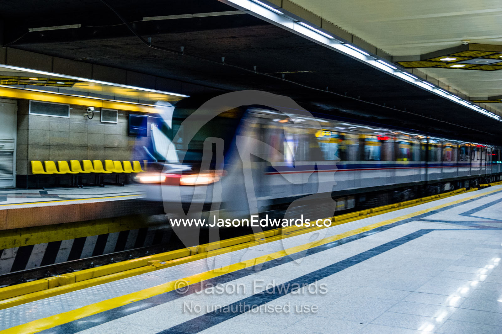 A train approaches a platform in a railway subway system beneath Tehran. Tehran, Tehran Province, Islamic Republic of Iran.