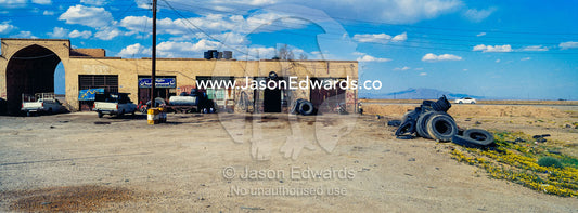A truck stop and mechanics workshop beside a highway. Road to Yazd, Yazd Province, Islamic Republic of Iran.