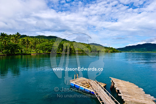 A small jetty and swimming pontoon in a tropical island bay. Natewa Bay, Vanua Levu, Pacific Ocean, Fiji Islands.