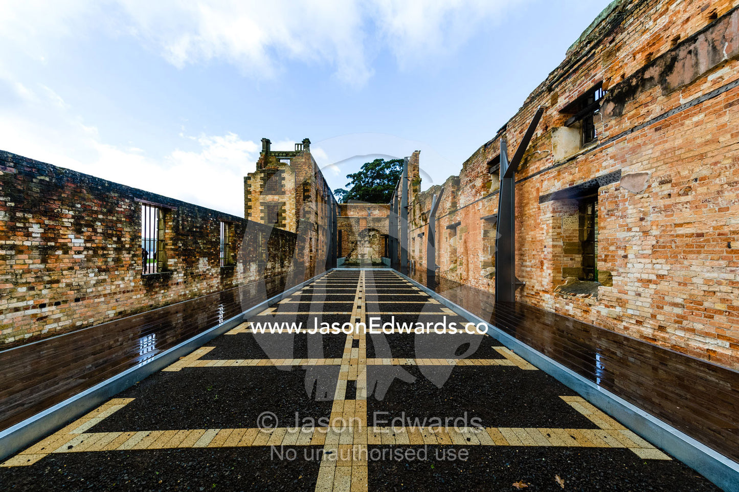 Rows of bricks form a template indicating where convict cells were positioned in the penitentiary. Port Arthur Historic Site, Port Arthur, Tasmania,
Australia.