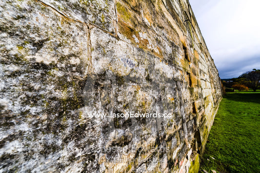 The weathered texture of a sandstone retaining wall constructed by convicts. Port Arthur Historic Site, Port Arthur, Tasmania,
Australia.
