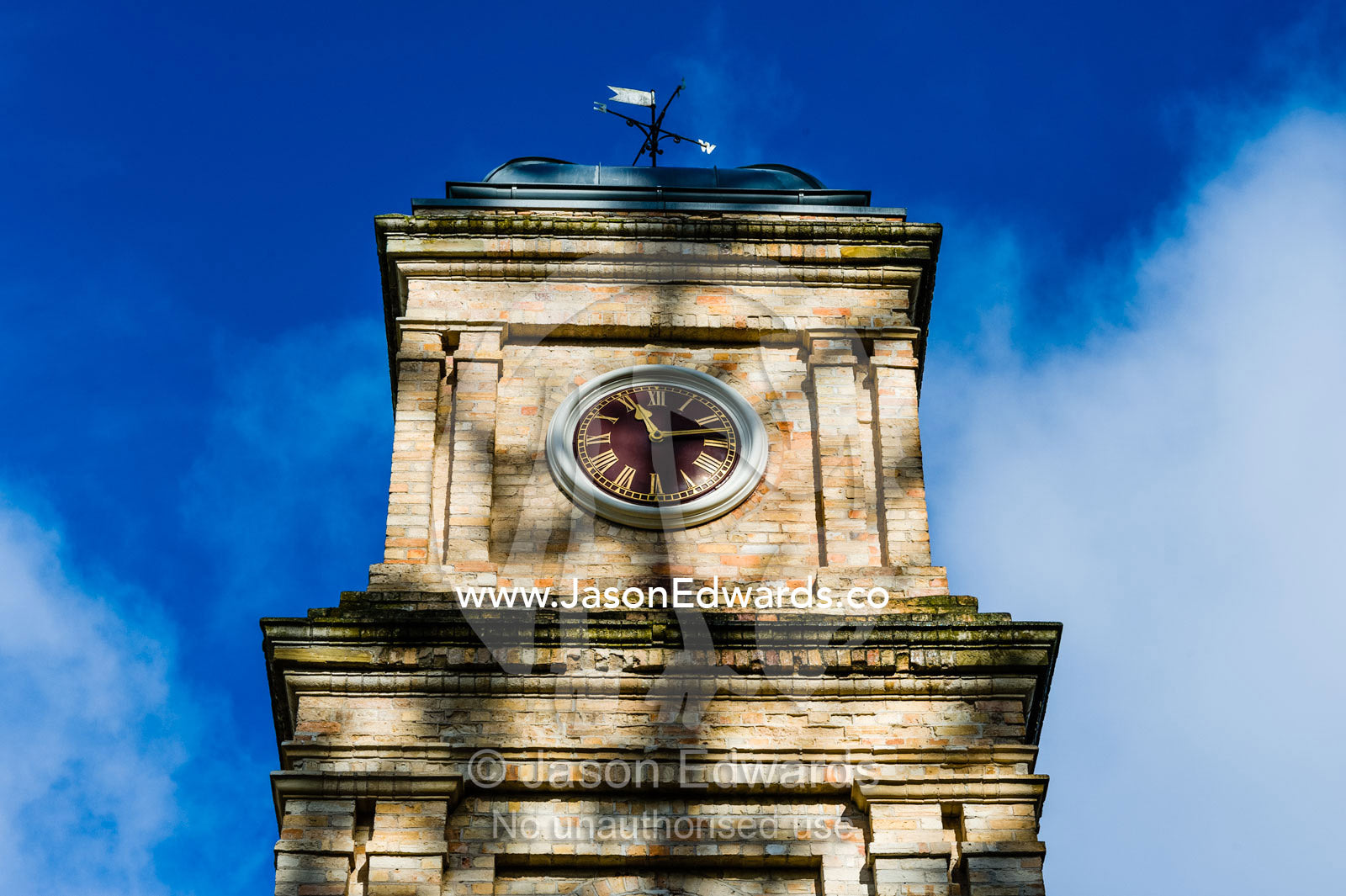 Dappled sunlight on the clock tower above the Asylum that cared for infirm prisoners. Port Arthur Historic Site, Port Arthur, Tasmania,
Australia.