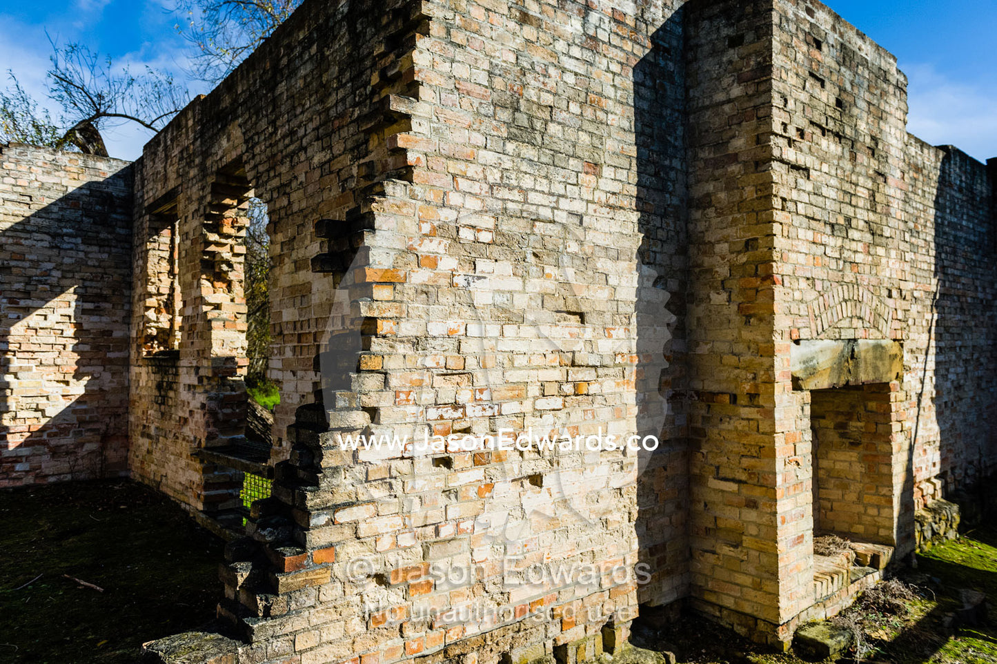 The ruins of a handmade brick wall and fireplace in the Pauper's Depot. Port Arthur Historic Site, Port Arthur, Tasmania,
Australia.