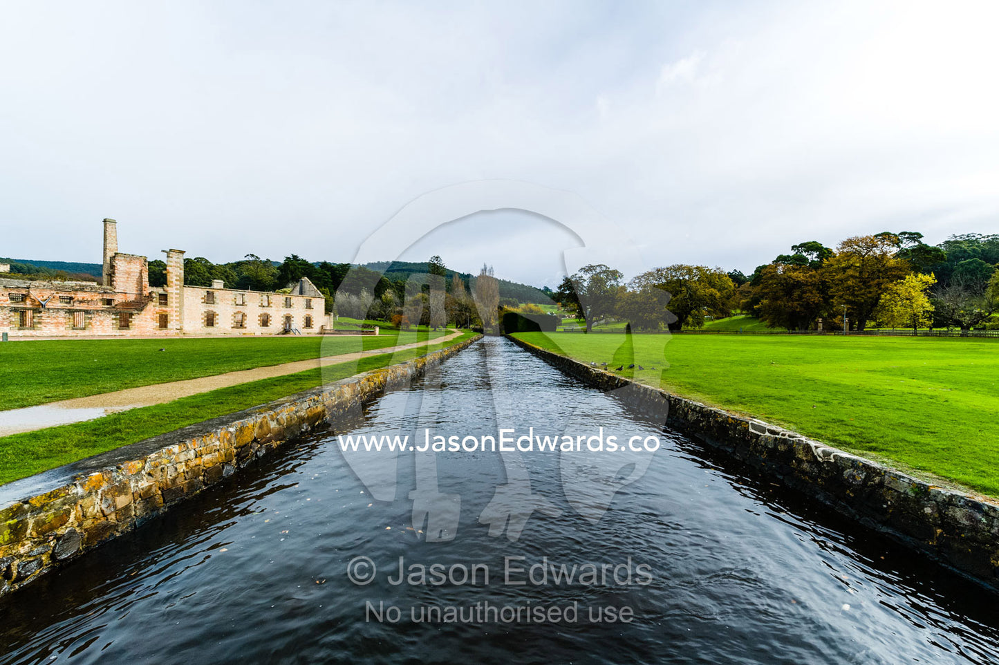 A river runs through a water canal in the lawns in front of the penitentiary. Port Arthur Historic Site, Port Arthur, Tasmania,
Australia.