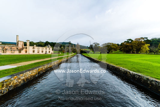 A river runs through a water canal in the lawns in front of the penitentiary. Port Arthur Historic Site, Port Arthur, Tasmania,
Australia.