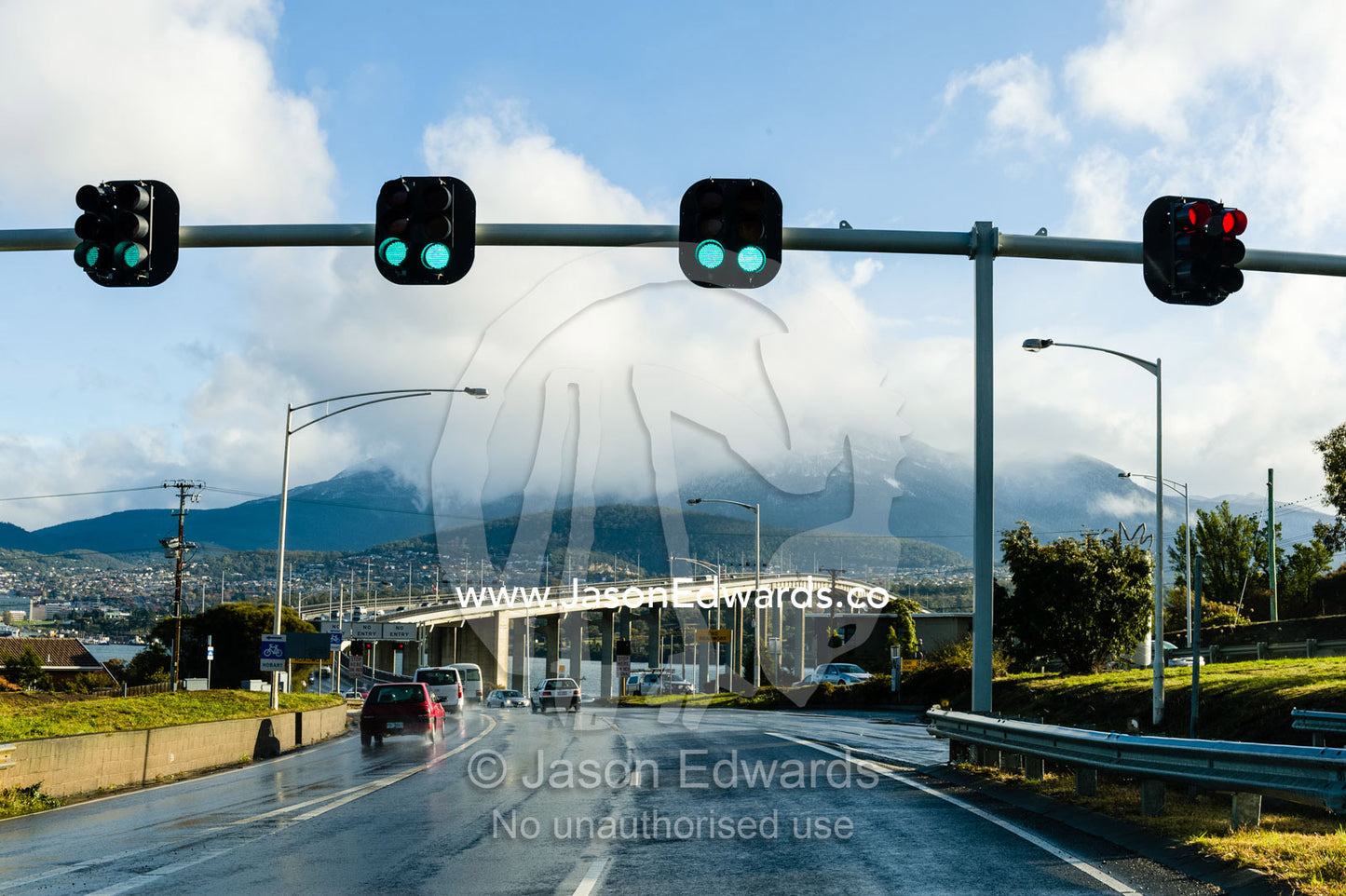 Traffic lights over a entry ramp to a bridge on a rainy day. Derwent River, Hobart, Tasmania,
Australia.