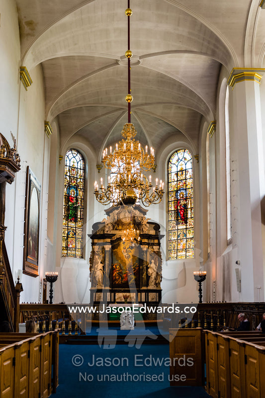 The alter and apse chancel as seen from the nave in the Church of the Holy Spirit. Church of the Holy Spirit, Copenhagen, Denmark.