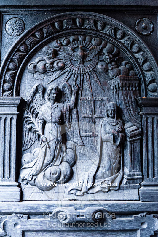 A timber relief depicting The Virgin Mary praying beneath an angel. Church of the Holy Spirit, Copenhagen, Denmark.