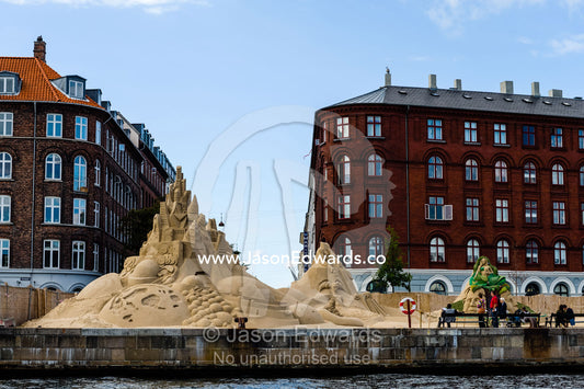 A sand castle competition along the foreshore of a canal in Copenhagen. Copenhagen, Denmark.