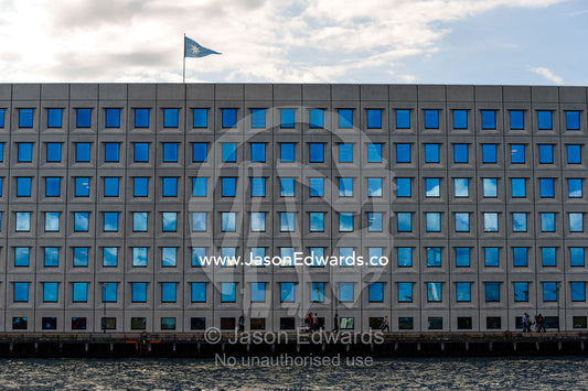 Cloud reflections in the opaque windows of an office block facade. Holmen, Copenhagen, Denmark.