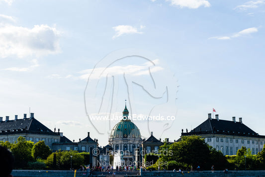 A church dome visible above the Amalienborg Palace. Frederiks Church, Copenhagen, Denmark.