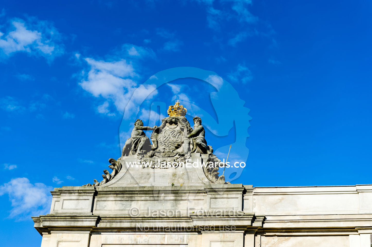 Statues on top of the Danish Parliament Christiansborg Palace gates. Christiansborg Palace, Frederiksholms Canal, Copenhagen, Denmark.
