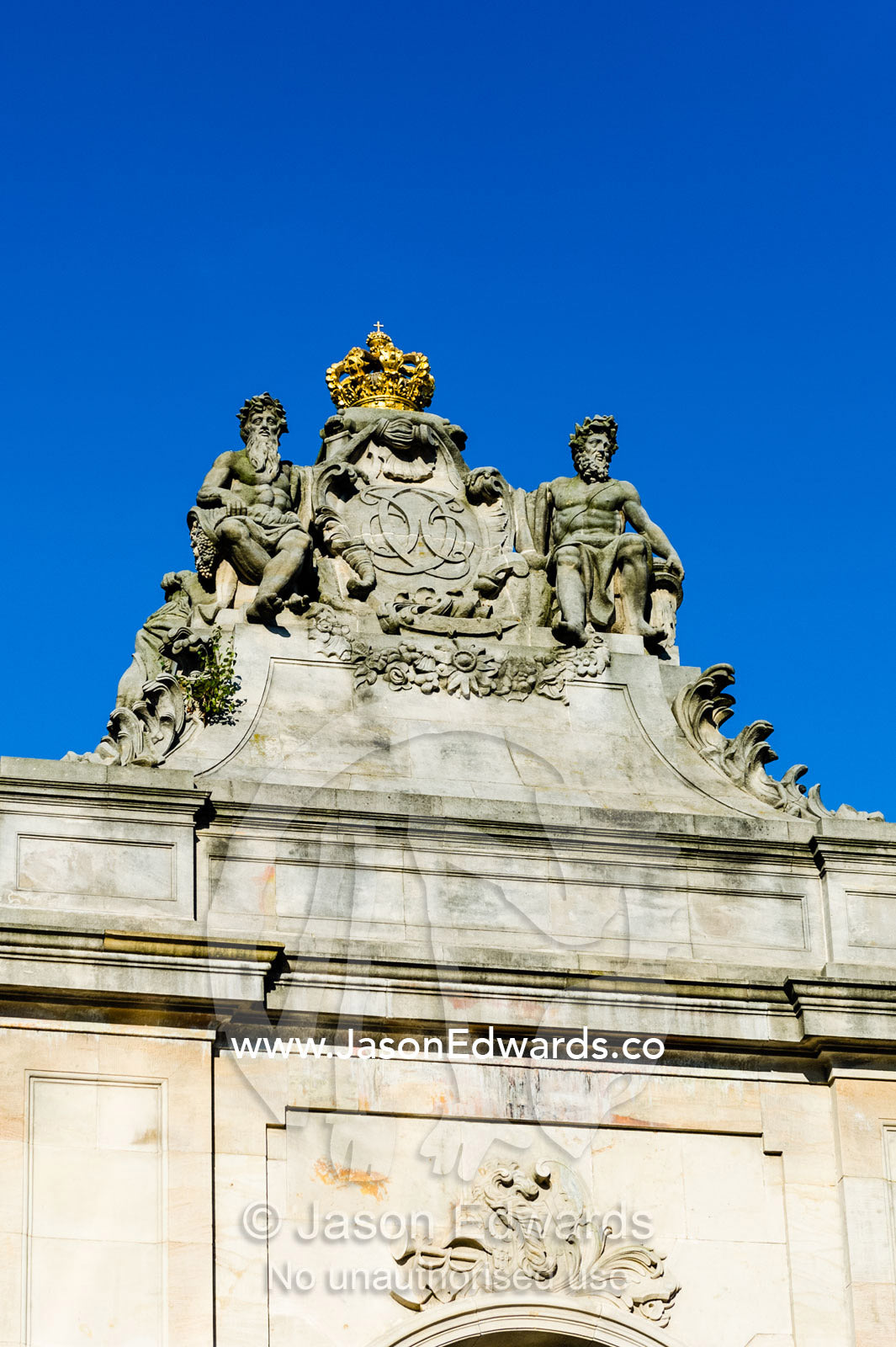 Statues on top of the Danish Parliament Christiansborg Palace gates. Christiansborg Palace, Frederiksholms Canal, Copenhagen, Denmark.