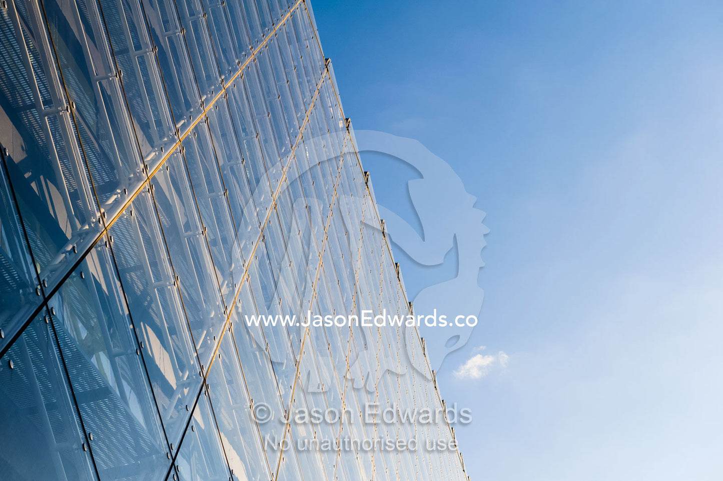 The glass and steel facade of a shopping complex in Copenhagen. Copenhagen, Denmark.